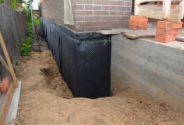 Happy homeowners after waterproofing job in Oak Creek